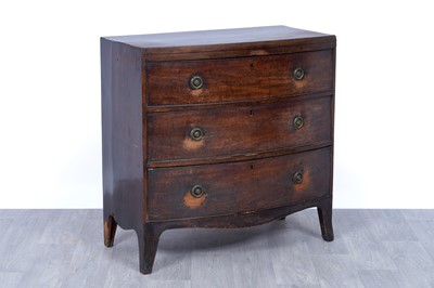 Lot 52 - A George III bowfront mahogany chest of drawers