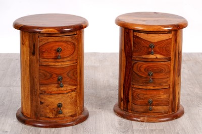 Lot 30 - A pair of contemporary hardwood cylindrical bedside chests