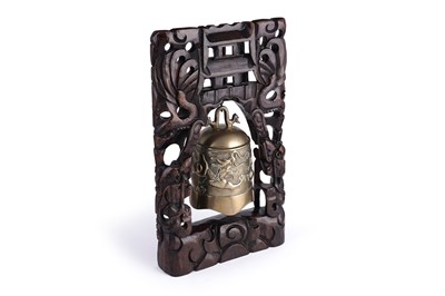 Lot 342 - A Chinese cast bronze bell and stand