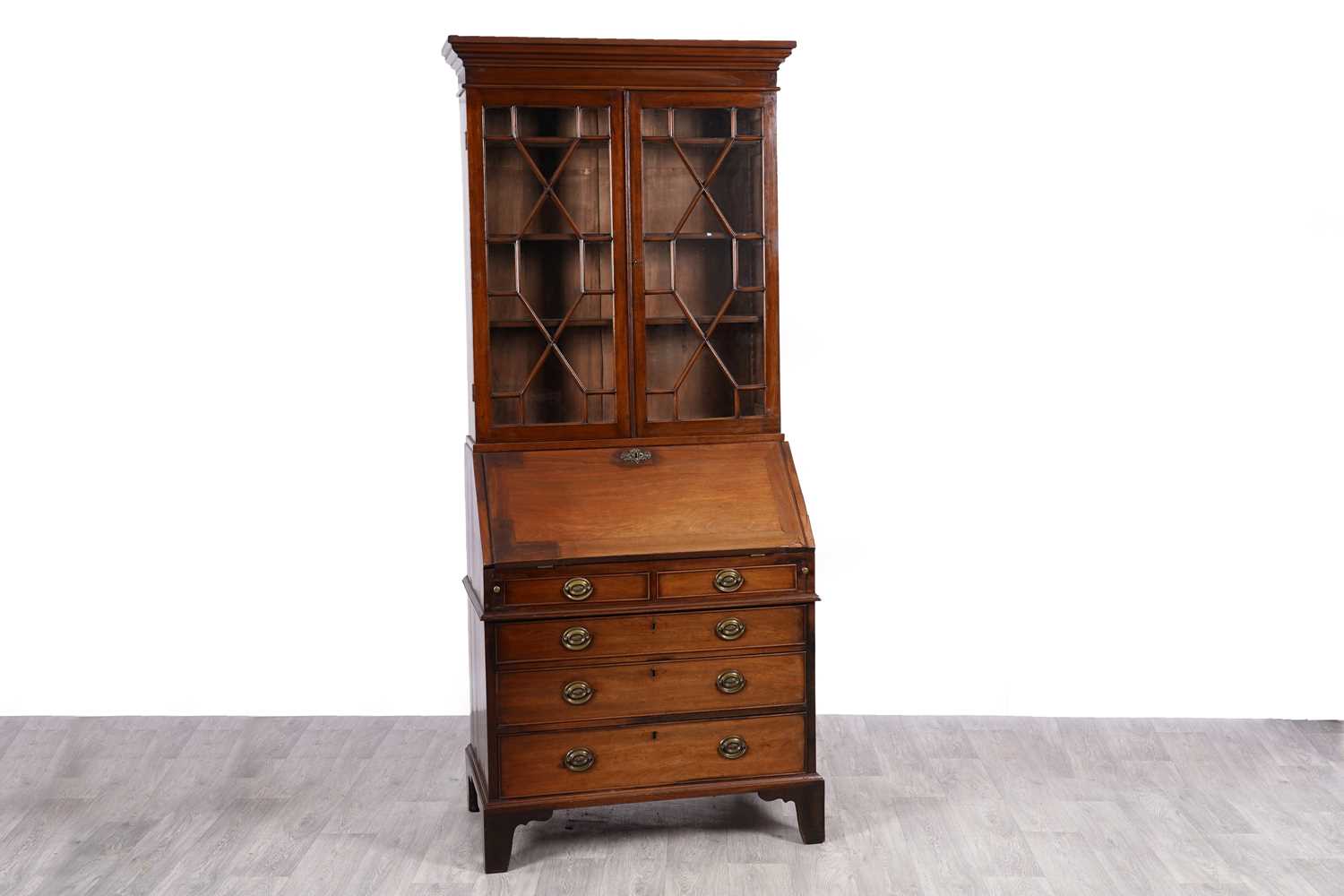 Lot 7 - A Georgian mahogany bureau bookcase
