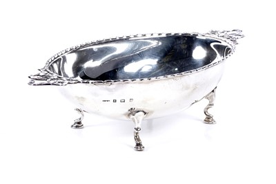 Lot 248 - An Edwardian silver bonbon dish with ribbon pattern handles
