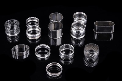 Lot 256 - A collection of predominantly Edwardian silver napkin rings