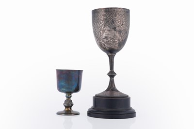 Lot 64 - A late Victorian engraved silver goblet; and another