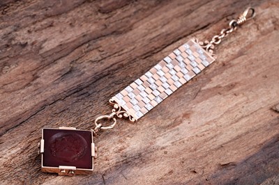 Lot 509 - A late 19th Century carved carnelian fob on mount