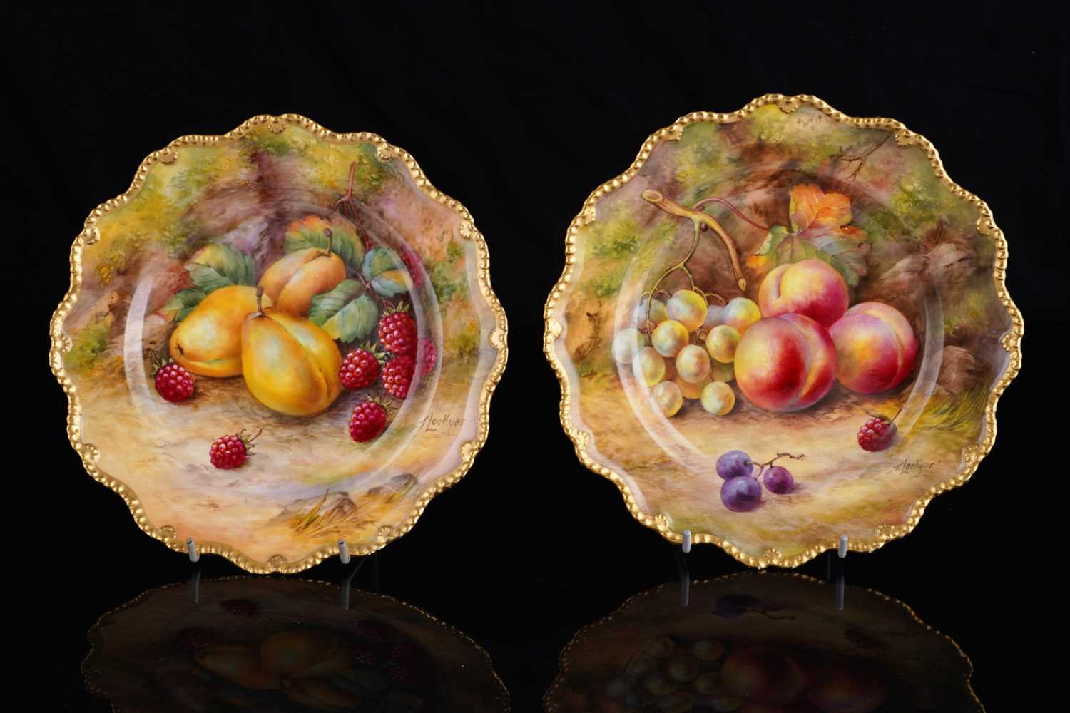 Lot 449 - A pair of Royal Worcester fruit-painted dessert plates