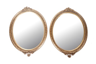 Lot 591 - A pair of 19th Century giltwood and gesso oval wall mirrors