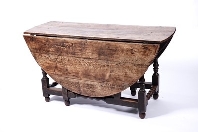 Lot 634 - A 17th Century oak dropleaf dining table