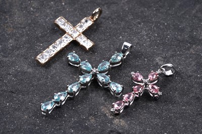 Lot 81 - Three contemporary 9ct gold cruciform pendants: one set with Padparadscha sapphire and diamond