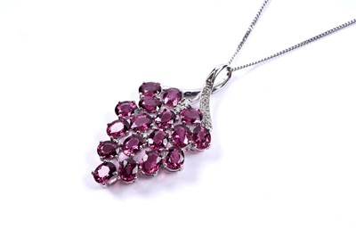 Lot 85 - A contemporary pink tourmaline and diamond pendant necklace