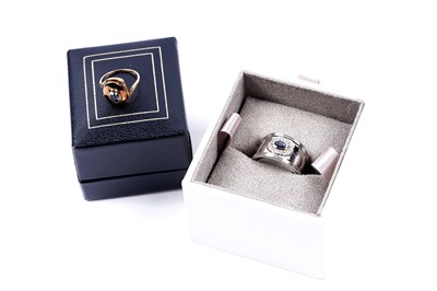 Lot 90 - A Clogau sapphire ring; and a Swiss blue topaz hidden locket ring, on 9ct gold
