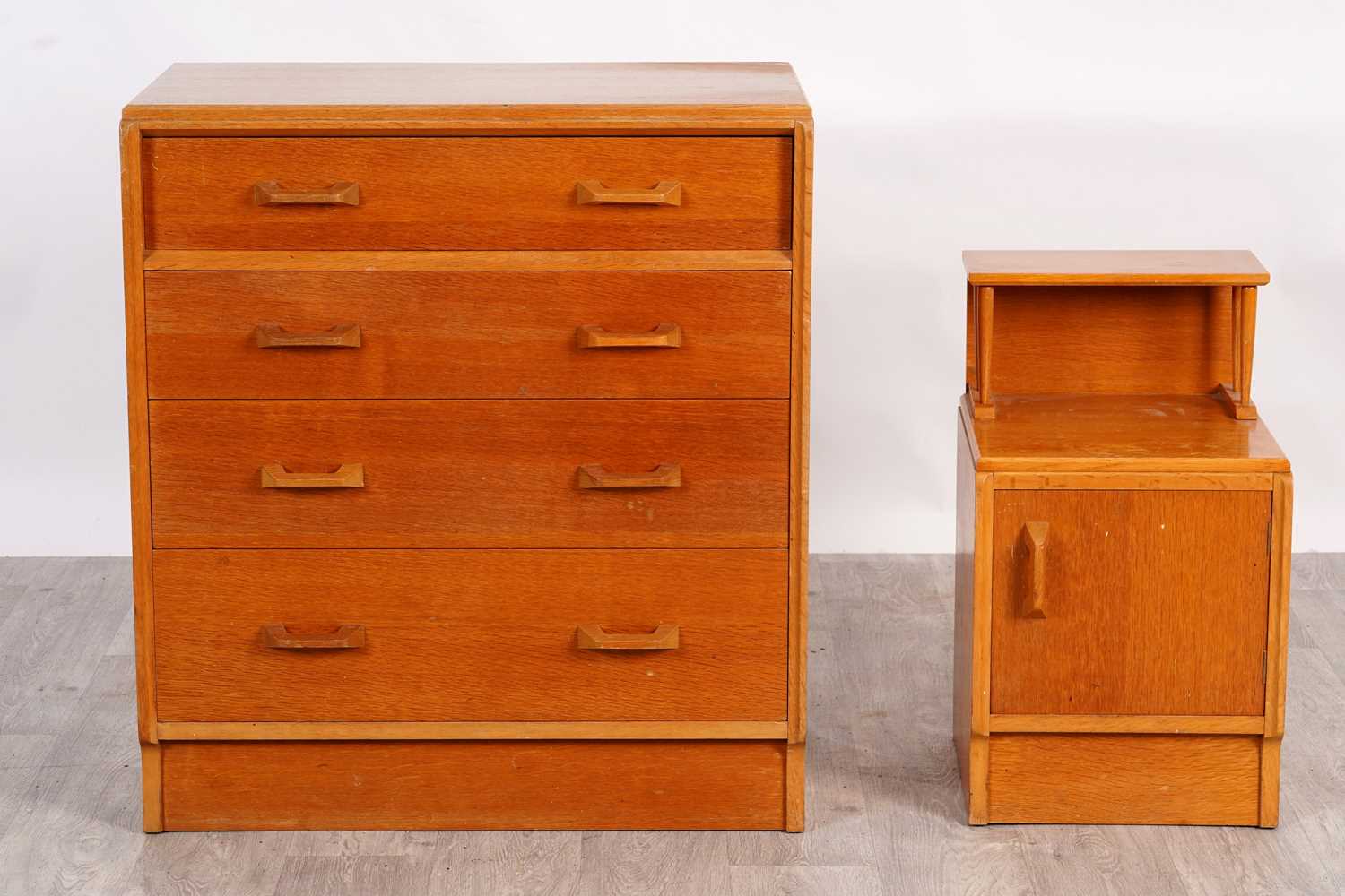 Lot 63 - G Plan: a ‘Brandon’ oak chest of four drawers; and a matching bedside cabinet