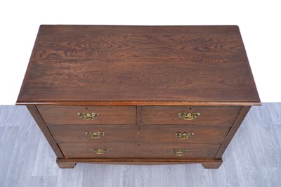 Lot 10 - A Georgian-style oak chest of drawers