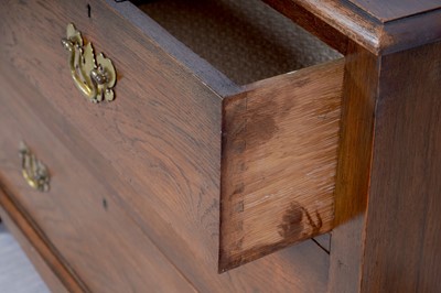 Lot 10 - A Georgian-style oak chest of drawers