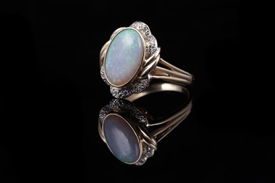 Lot 51 - An opal and diamond dress ring