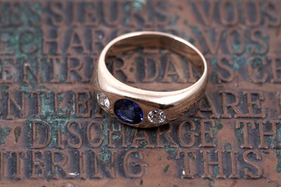 Lot 53 - A sapphire and diamond three stone ring