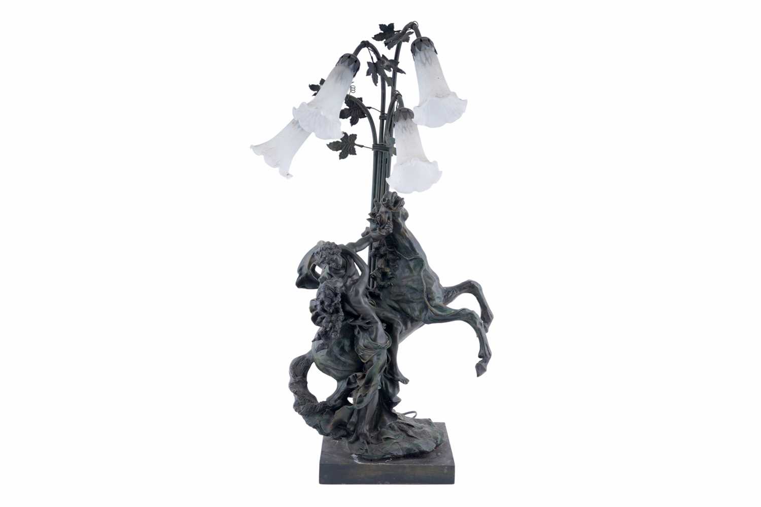 Lot 109 - A bronze effect figural table lamp