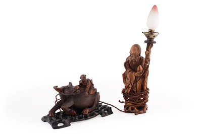 Lot 243 - A Chinese style carved hardwood figure and table lamp