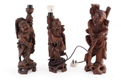 Lot 110 - A group of three 20th Century Chinese hardwood figural table lamps