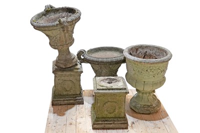 Lot 271 - A pair of neoclassical composite garden urns on stands; and another planter