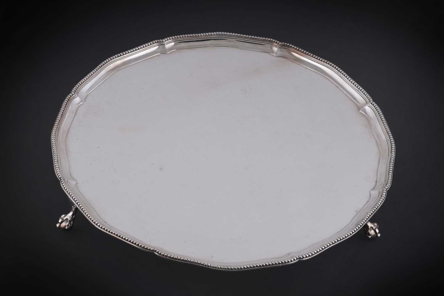 Lot 52 - A George III silver salver of shaped circular outline