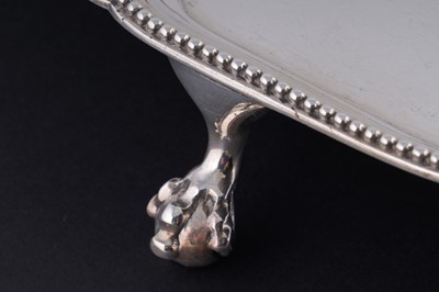 Lot 52 - A George III silver salver of shaped circular outline