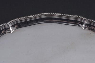 Lot 52 - A George III silver salver of shaped circular outline