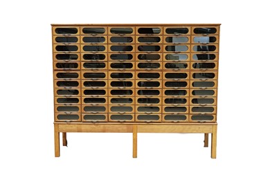 Lot 615 - An early 20th Century beech haberdashery cabinet