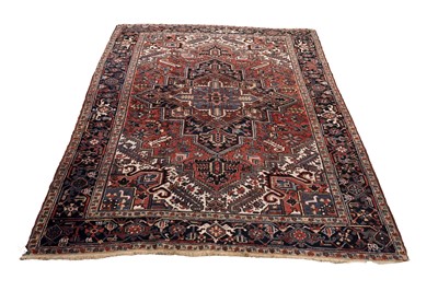 Lot 555 - A hand-knotted Persian Heriz carpet