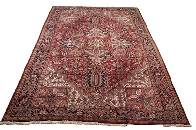 Lot 546 - A hand-knotted Persian Heriz carpet