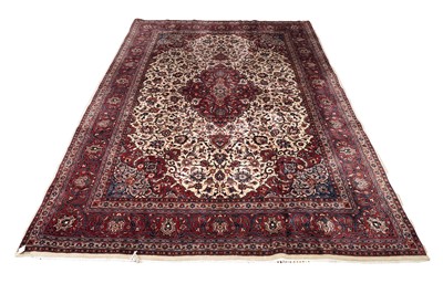 Lot 547 - A hand-knotted Persian Kashan carpet