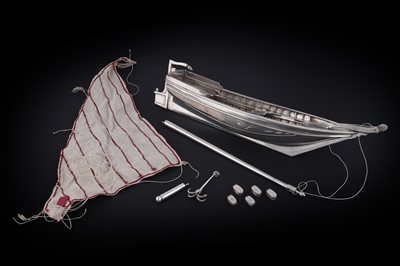 Lot 88 - A 20th Century hand-made silver model of a single-masted sailing dinghy with anchor