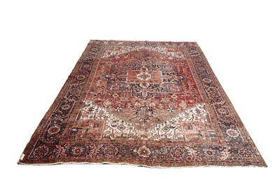 Lot 562 - A hand-knotted Persian Heriz carpet