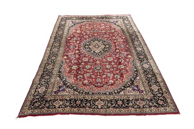 Lot 550 - A hand-knotted Persian Mashad carpet