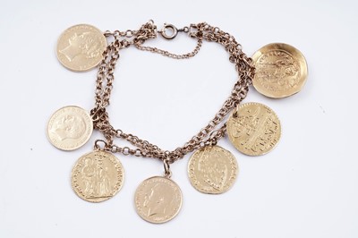 Lot 296 - A fancy figaro-link bracelet; and seven pendant coins