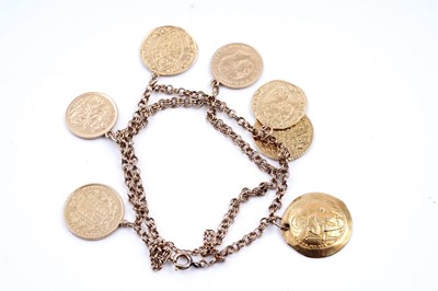Lot 296 - A fancy figaro-link bracelet; and seven pendant coins