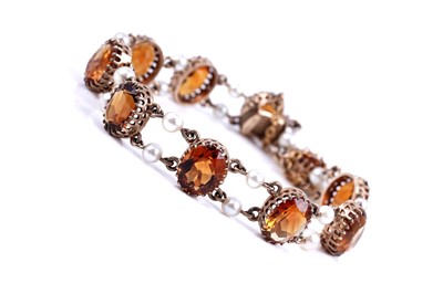 Lot 512 - An Edwardian style citrine and cultured pearl bracelet