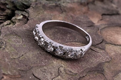 Lot 514 - A seven-stone diamond half-hoop eternity ring
