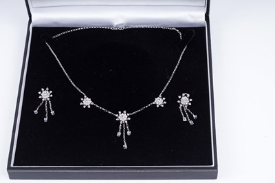 Lot 476 - A diamond, sapphire, and pink sapphire necklace and matching earrings