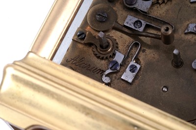 Lot 452 - A late 19th Century French gilt brass and champleve repeating carriage alarm clock