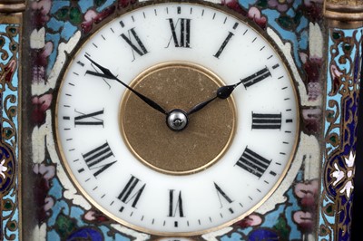 Lot 454 - A late 19th Century brass and champleve enamel petite sonnerie carriage clock