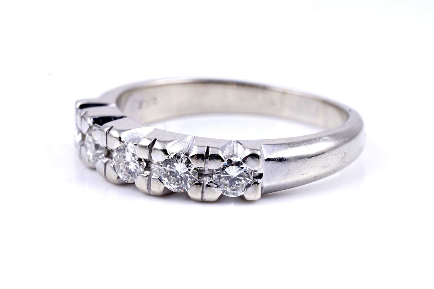 Lot 18 - A diamond five-stone half-hoop eternity ring