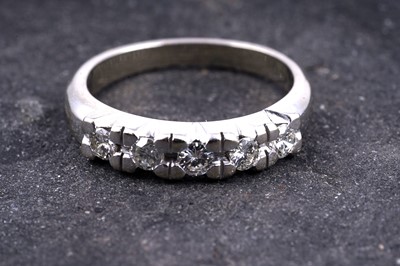 Lot 18 - A diamond five-stone half-hoop eternity ring