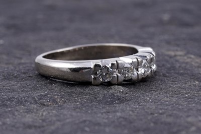 Lot 18 - A diamond five-stone half-hoop eternity ring