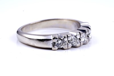 Lot 18 - A diamond five-stone half-hoop eternity ring