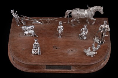 Lot 96 - A presentation group of Victorian silver peasant farm worker figures and farm animals