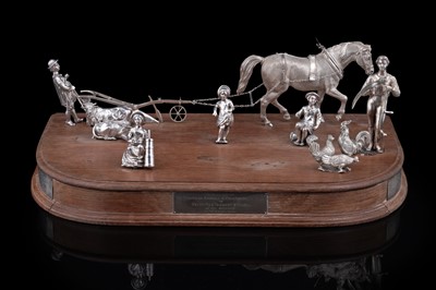 Lot 96 - A presentation group of Victorian silver peasant farm worker figures and farm animals