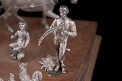 Lot 96 - A presentation group of Victorian silver peasant farm worker figures and farm animals