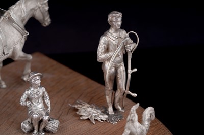 Lot 96 - A presentation group of Victorian silver peasant farm worker figures and farm animals