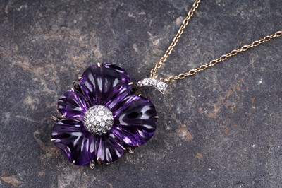 Lot 524 - A late Victorian carved amethyst and diamond pansy pendant