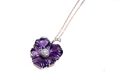 Lot 524 - A late Victorian carved amethyst and diamond pansy pendant